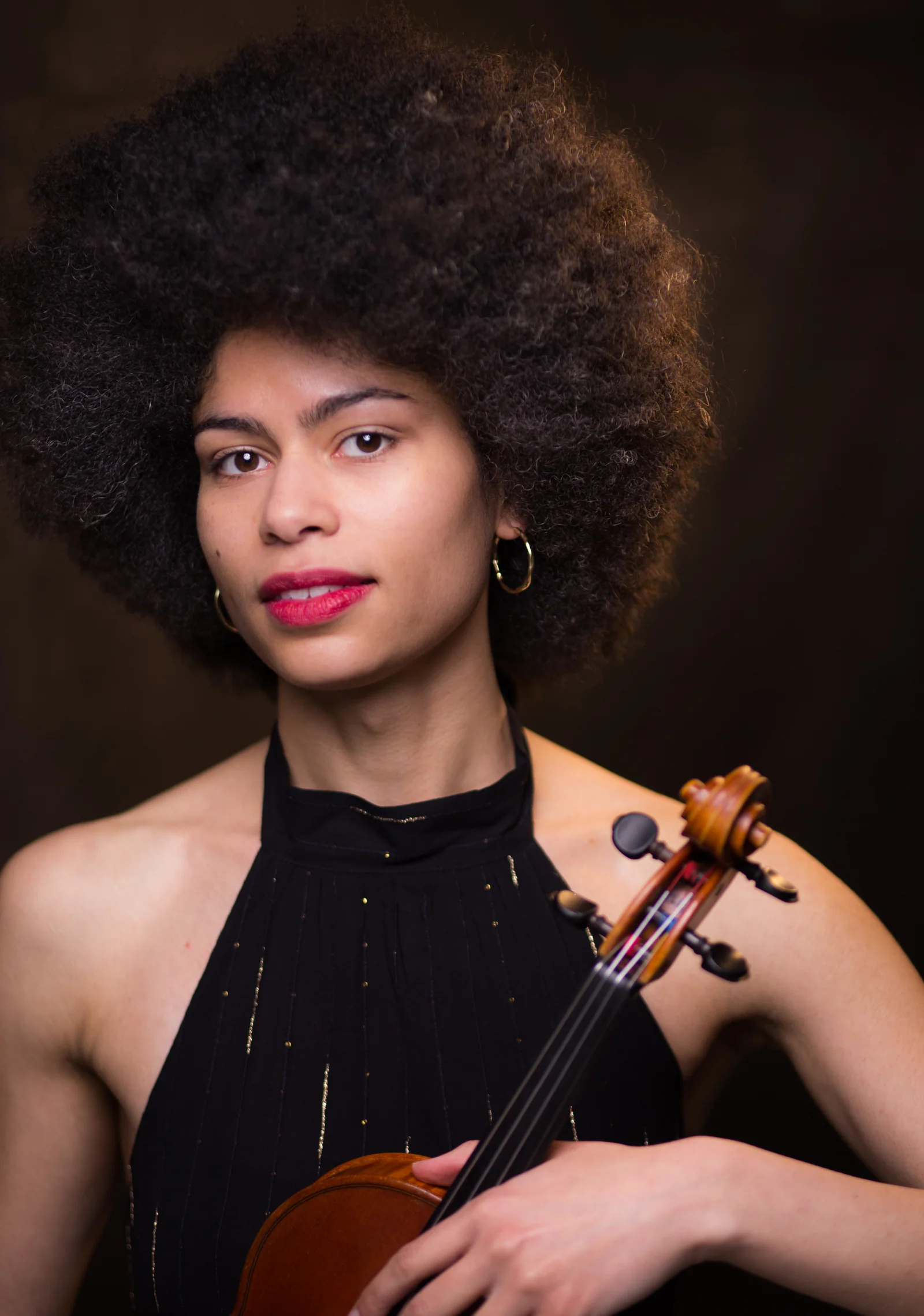 Fay Guiffo holding her violin.